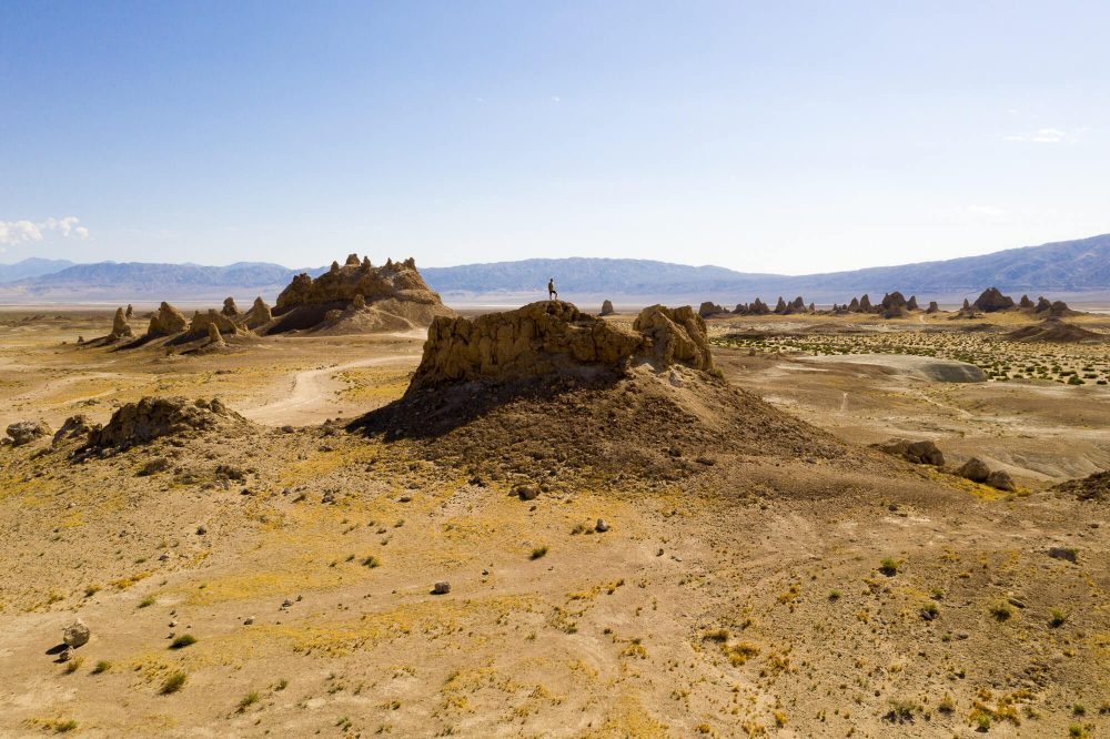 dji mavic pro 2 photo of tyler minney standing on a rock in the middle of trona pinnacles | photo by jake landon schwartz